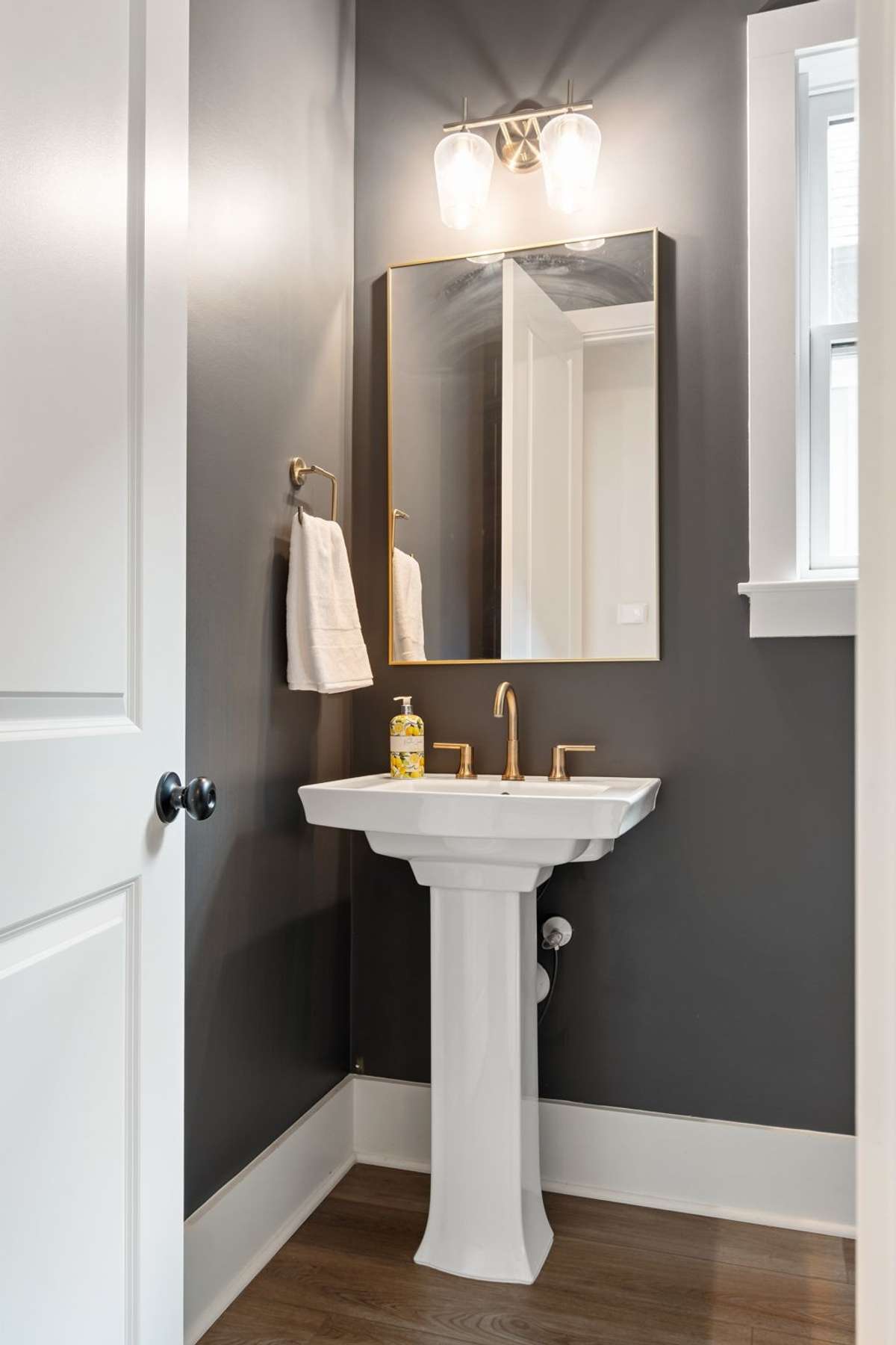 Half bath located conveniently just off the kitchen.