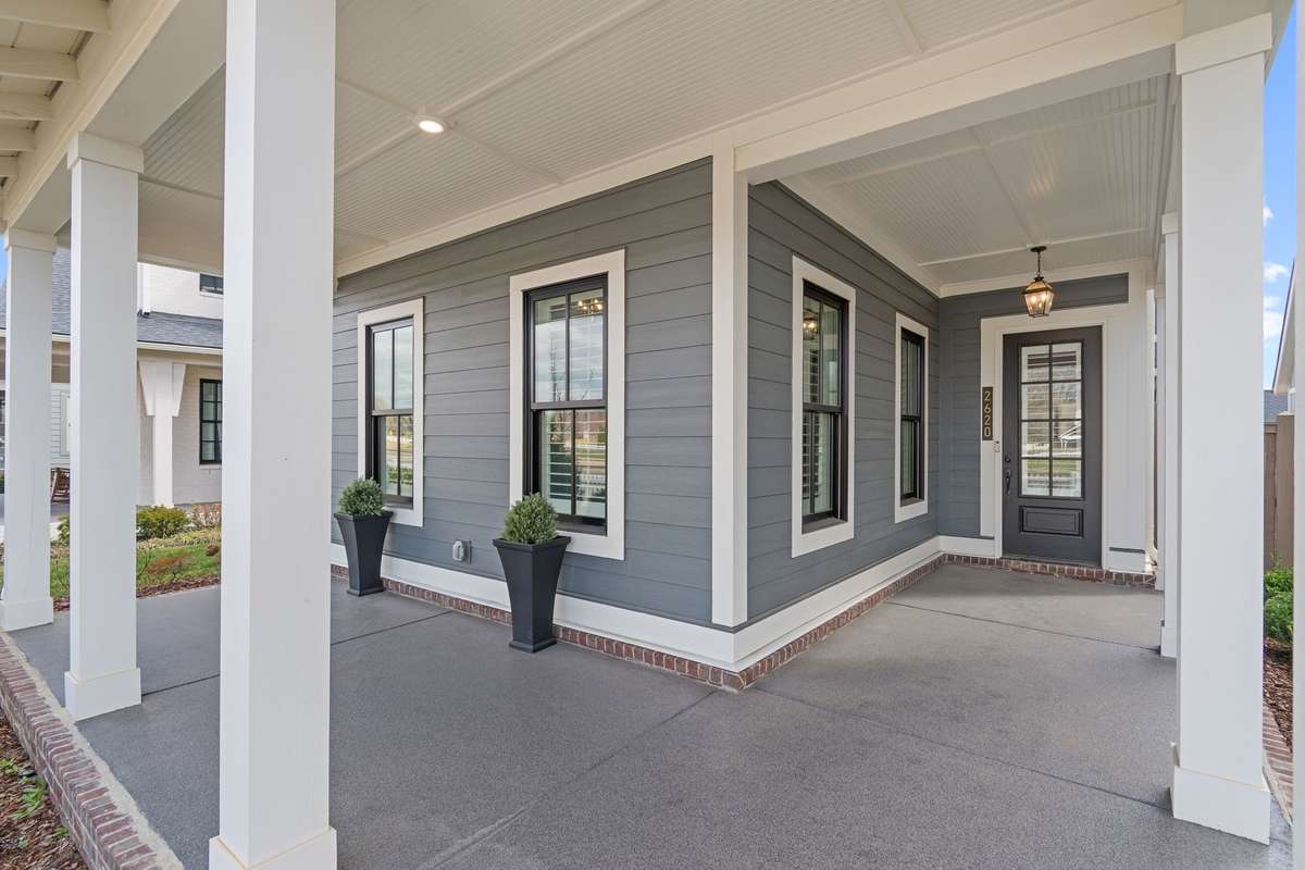 This front porch is perfect for your favorite outdoor furniture and it creates a beautiful place to visit with family and friends.