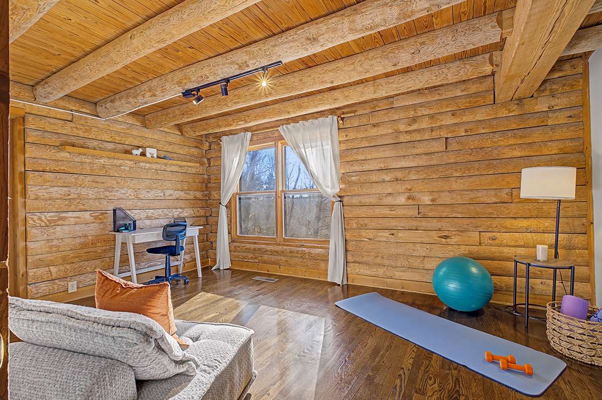 Main level bedroom suite or ideal office/writing/fitness/reading/meditation room