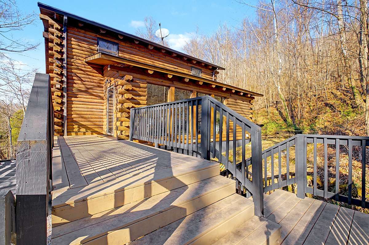 Nestled in over 5 acres of secluded wooded land