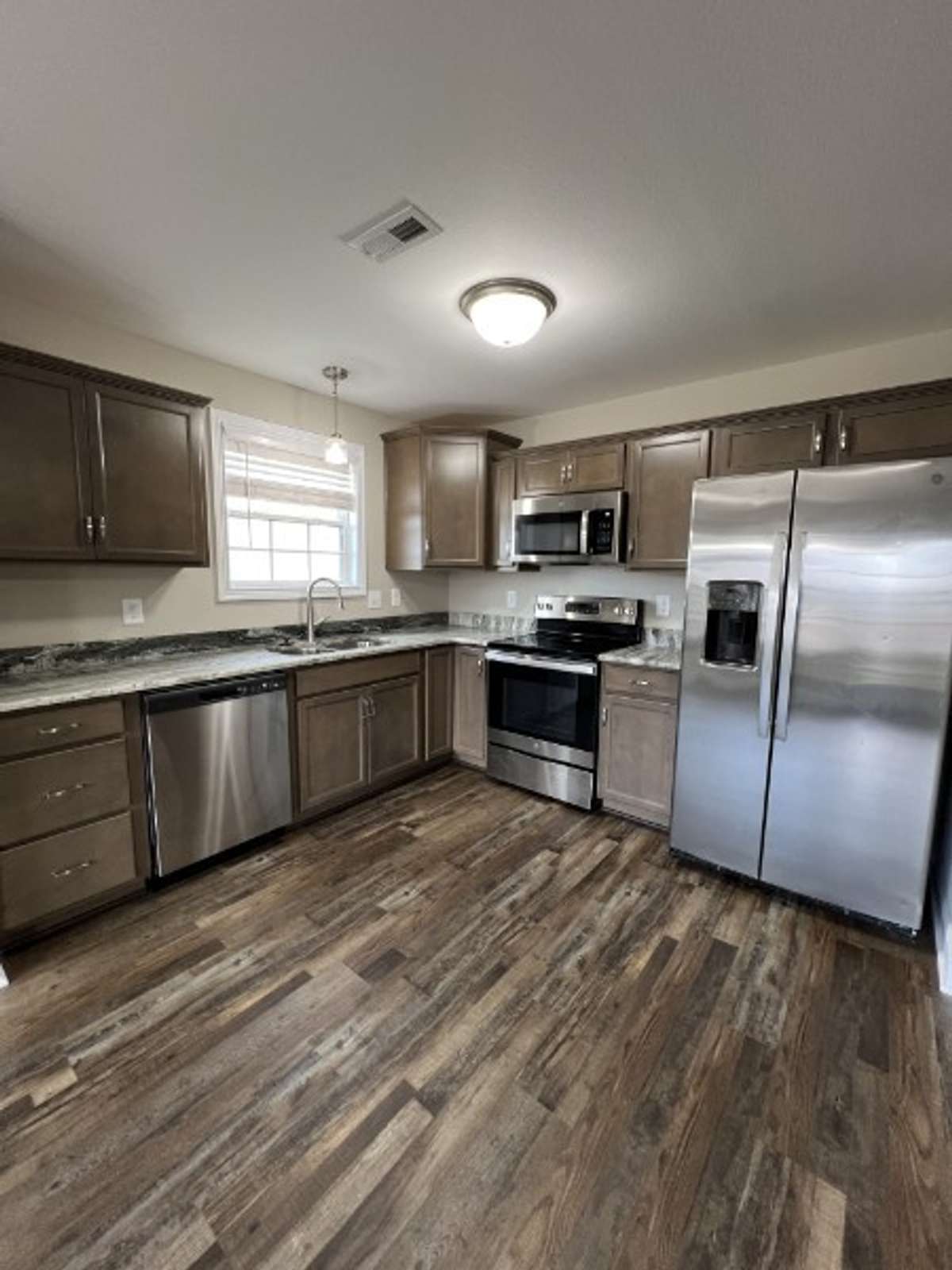 Gorgeous open kitchen is spacious enough for a rolling island!