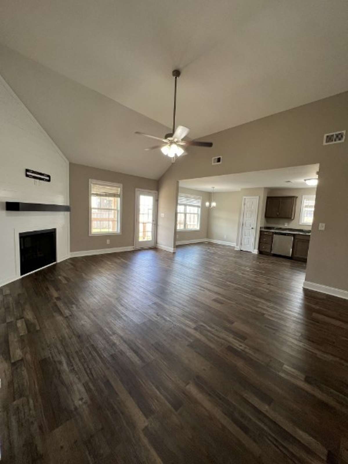 Great entertaining & family flow since it's open to the kitchen & dining area. The shiplap fireplace wall is stunning!!