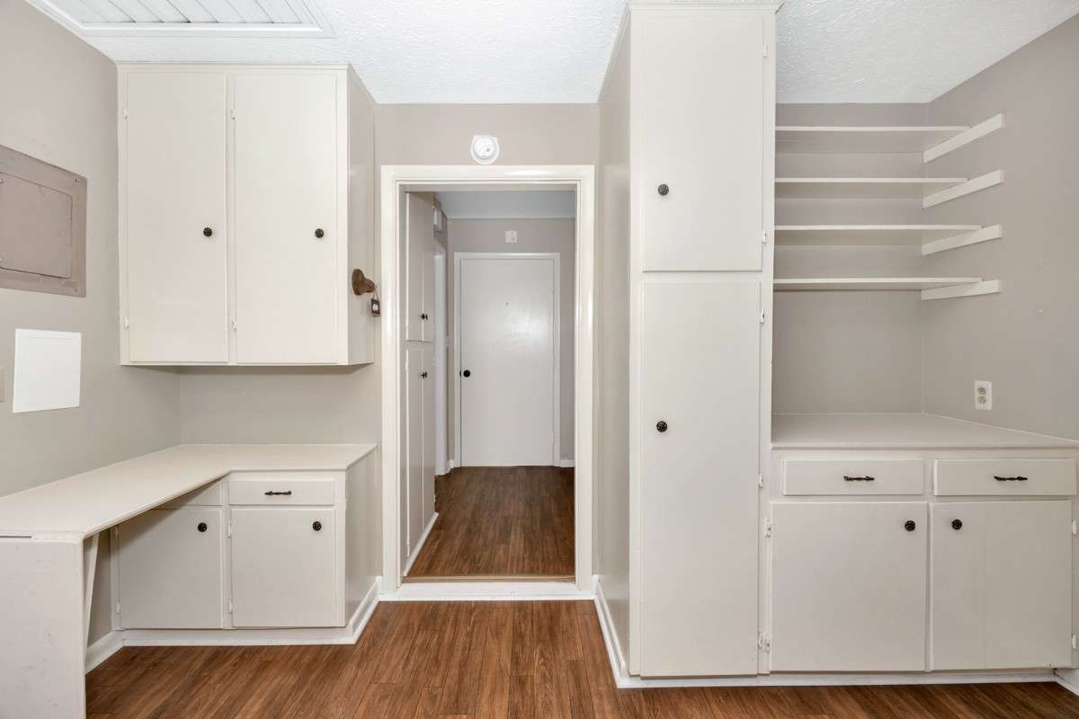 Other room- Vinyl flooring, built in desk, cabinets and shelving
