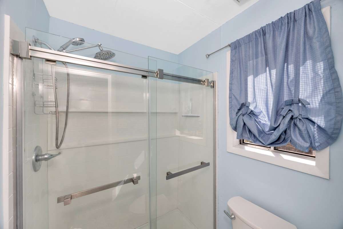 3/4 bath- tile flooring, shower