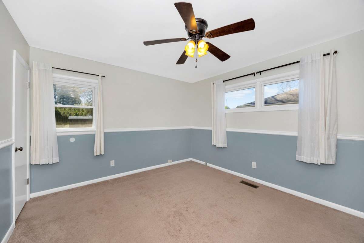 Bedroom- carpet, chair rail, ceiling fan, 3/4 bath
