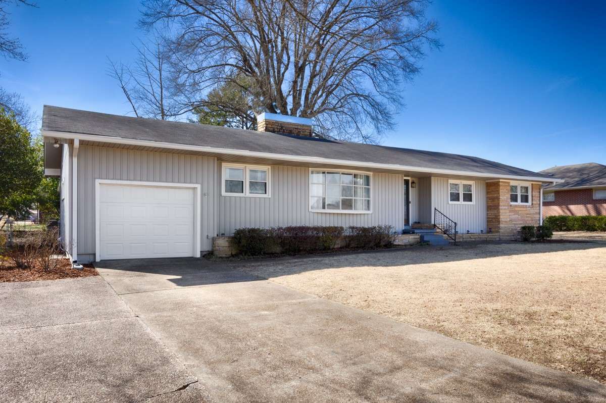 Front of house- Vinyl Siding, concrete driveway, attached single car garage, covered front porch, simple landscaping