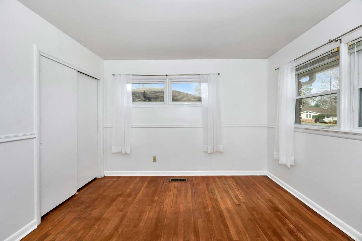 Bedroom- wood flooring, chair rail