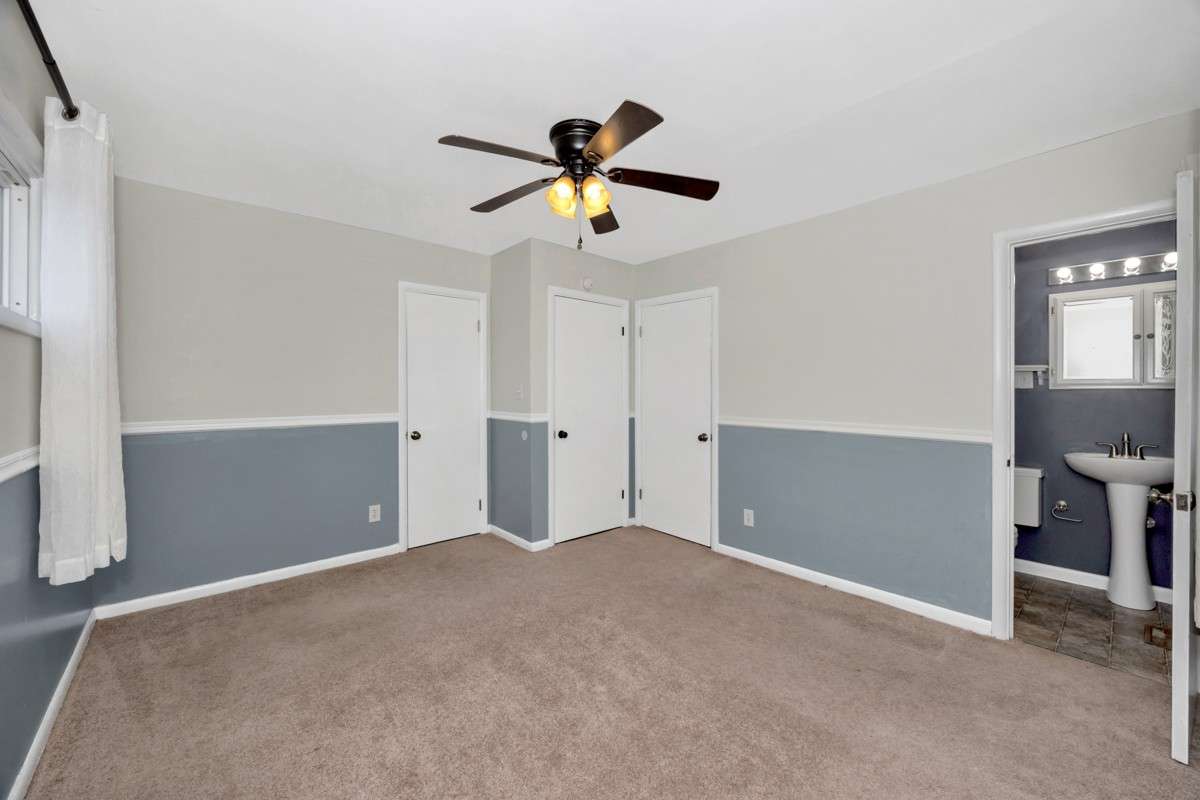 Bedroom- carpet, chair rail, ceiling fan, 3/4 bath