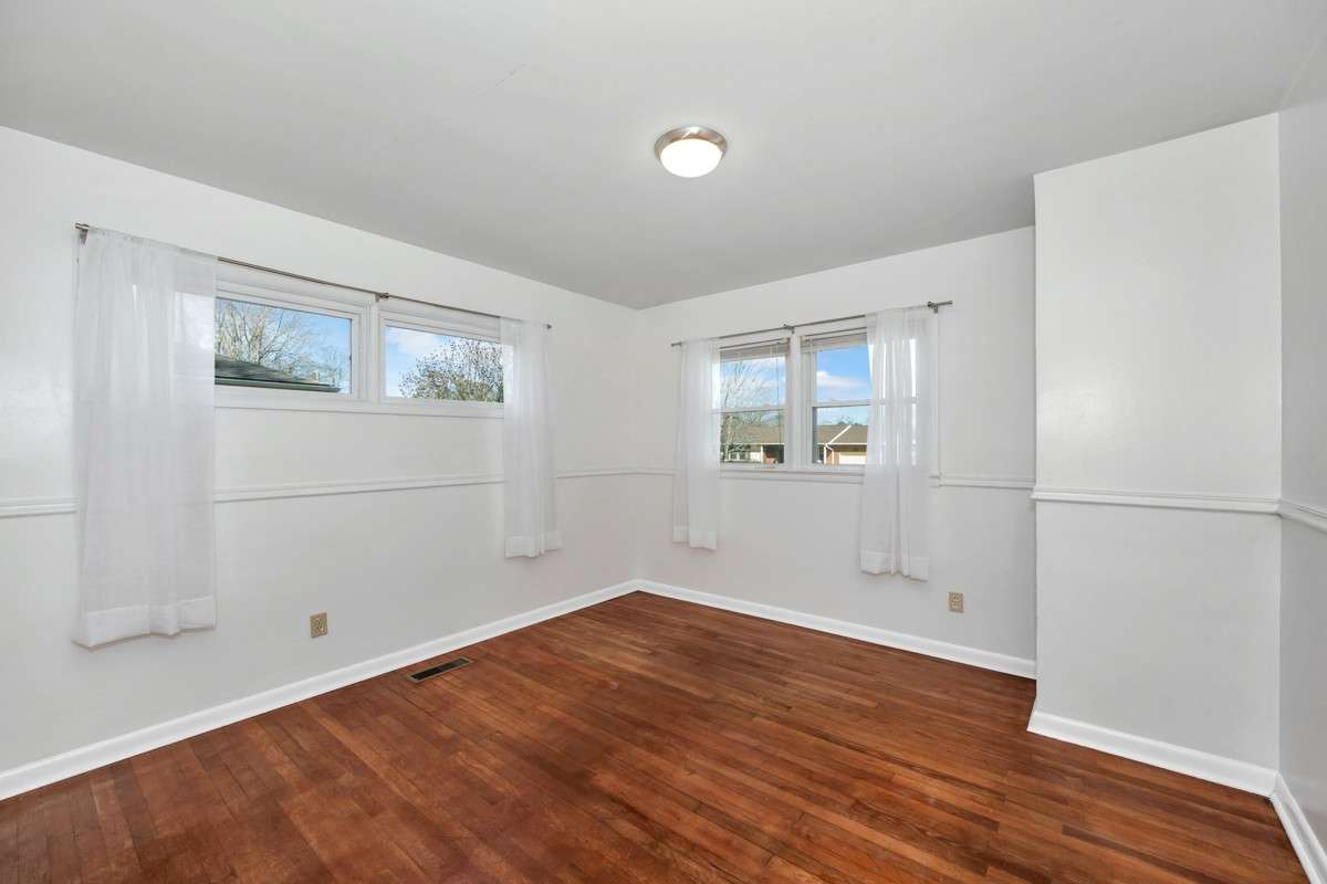 Bedroom- wood flooring, chair rail
