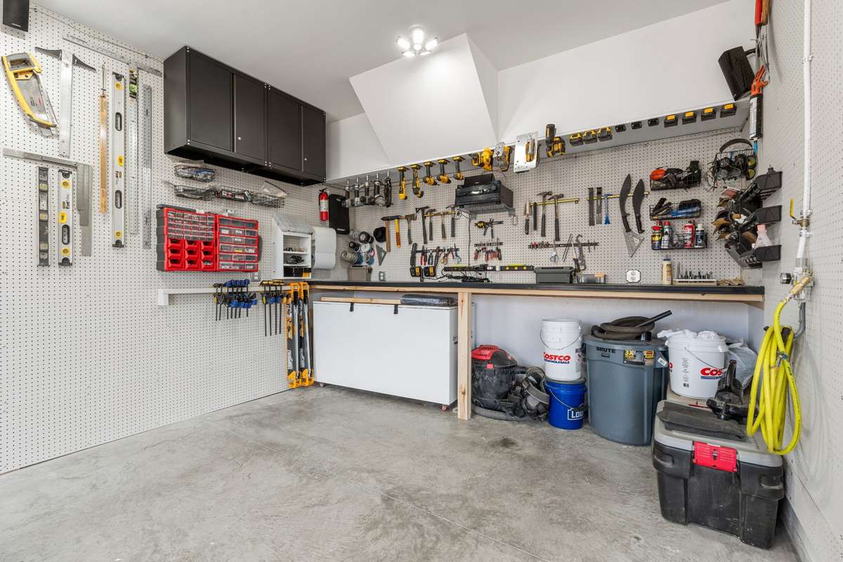 Extended third bay of garage for workbench.