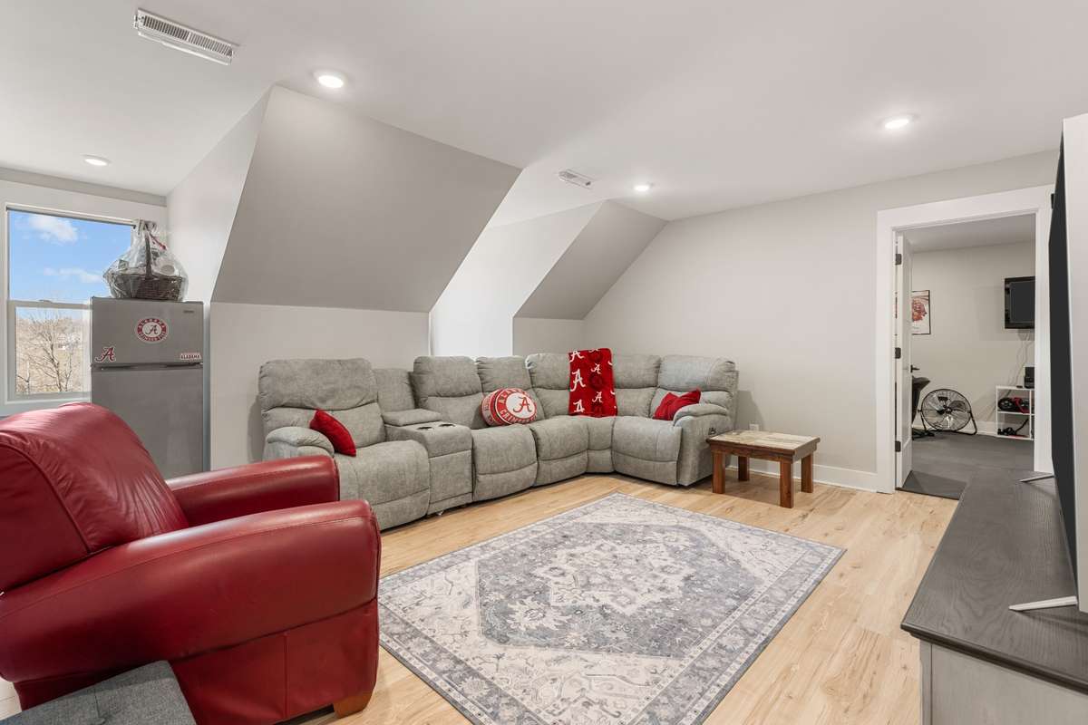 Bonus room with two dormer windows and entry into the additional bonus room.
