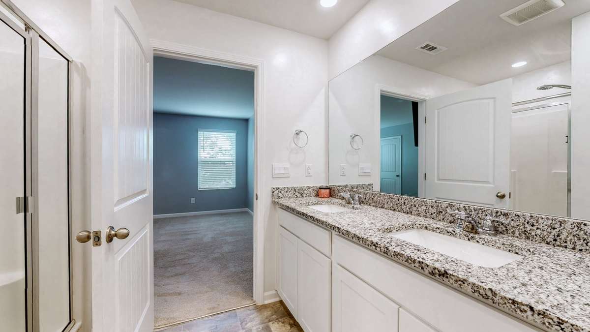 Owner's Suite Full bath includes Shower, Double Vanity with Granite, linen Closet, and private toilet area