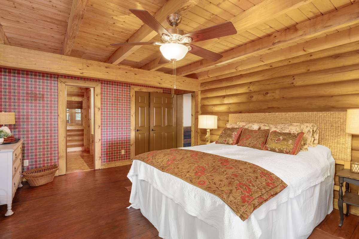 Primary bedroom- located on main floor with lake view