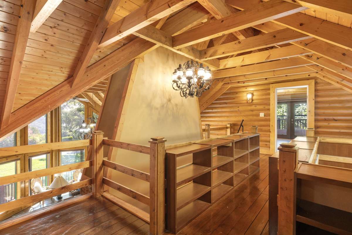 Upstairs catwalk and landing over looking living room and foyer