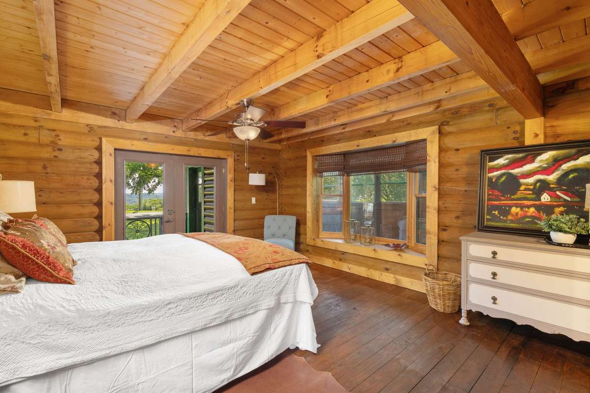 Primary bedroom- located on main floor with lake view