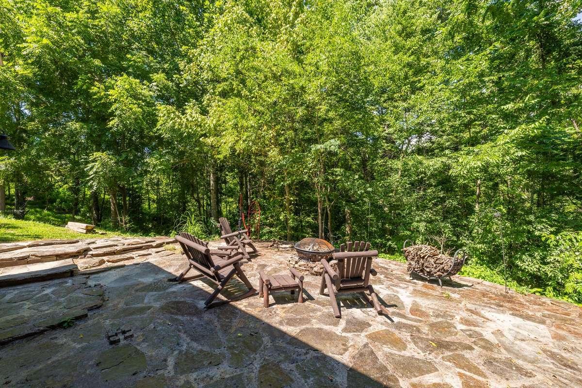 Back patio - includes outdoor furniture and enclosed fire pit - ready to make memories and roast marshmallows