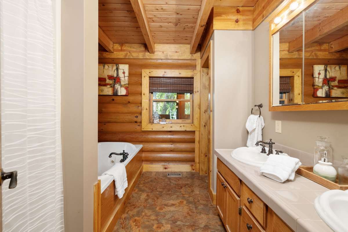 Primary bathroom with jetted tub and separate shower.