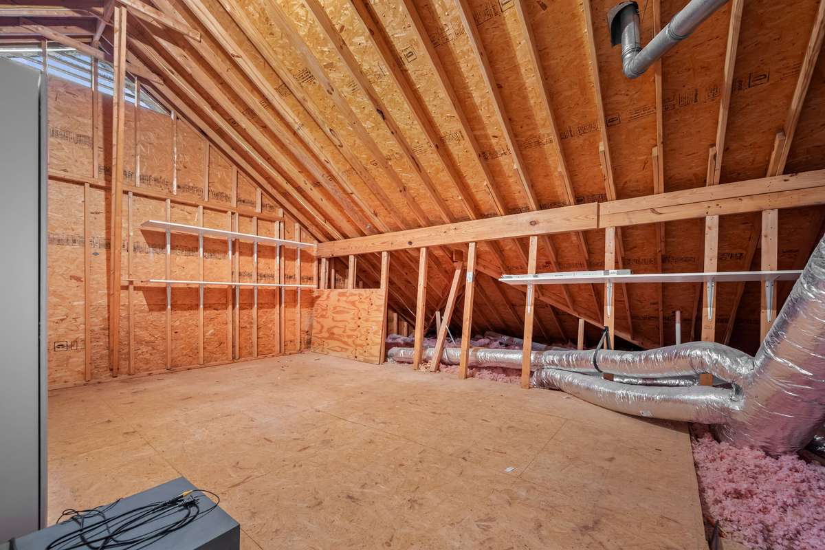 Walk in attic off of the bonus room has an abundance of space to store your holiday decor,  off season items or family heirlooms.