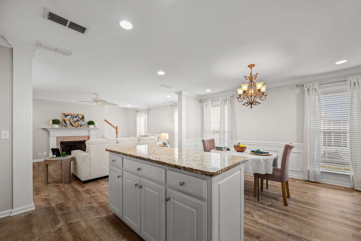 View of kitchen looking into family room and dining space.  Great house for entertaining family and friends.