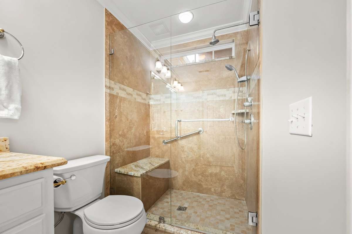 Beautiful walk in shower complete with tiled bench and glass doors, giving you a little luxury in your own space.