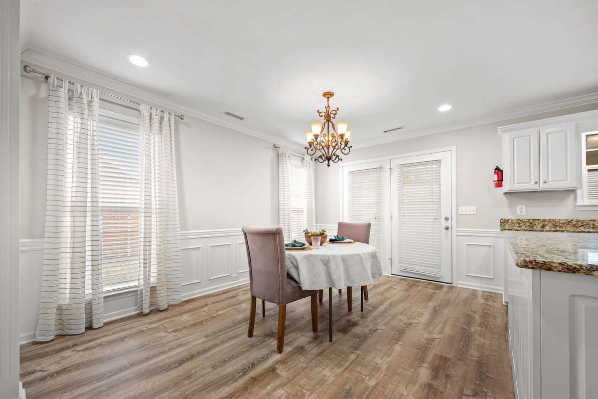 Dining room leads onto sunroom on rear of house.