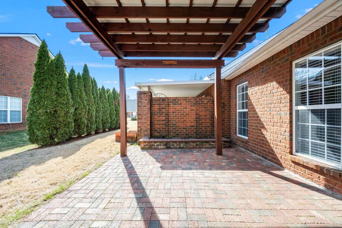 Back patio has plenty of space for entertaining or just enjoying the sunshine.  Covered pergola allows for enjoyment in the shade.