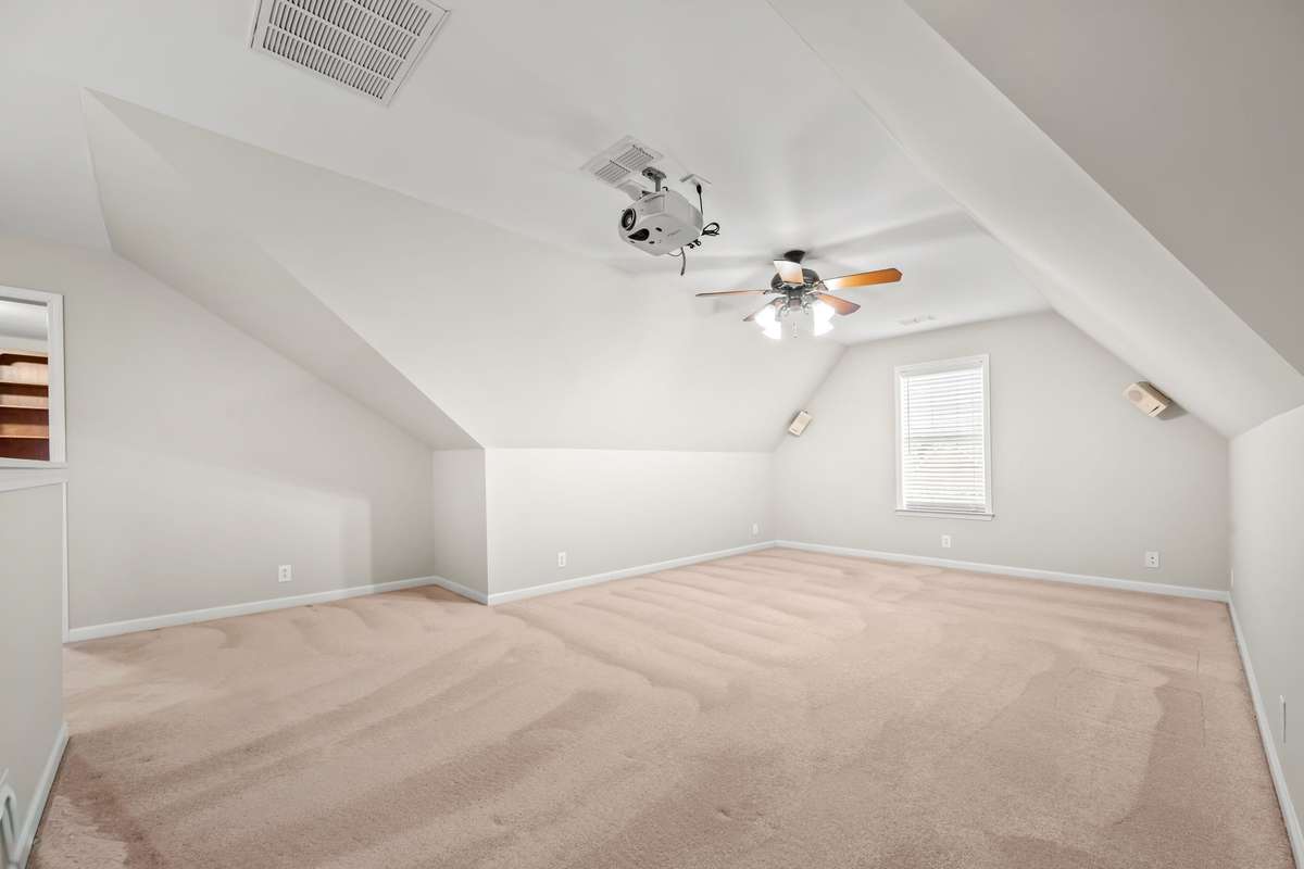 Upstairs bonus space has a multitude of uses.  This would be a great recreation space for you or your guests, crafting space or movie room.