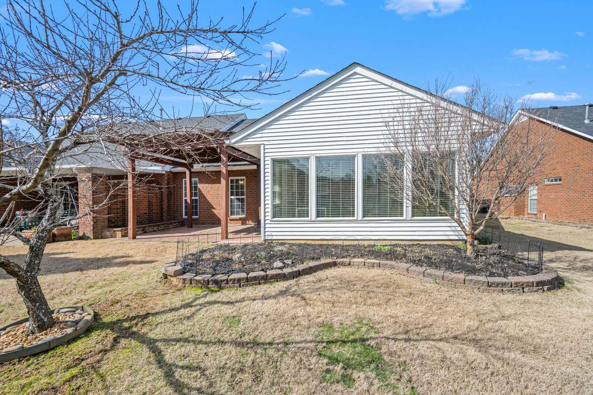 Rear of home - imagine this as the beautiful mature landscape comes alive in the Spring.