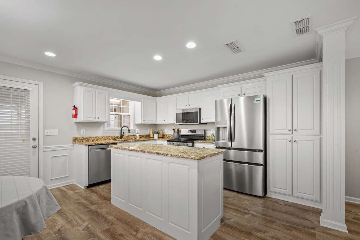 Island in the kitchen extends your amount of prep space for dinner.