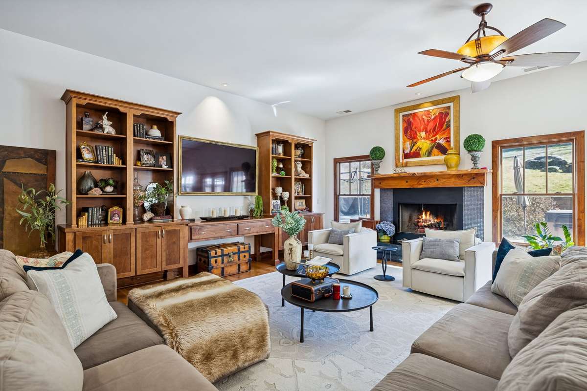 The Living area of the Great Room has a wood-burning fireplace with propane gas starter and built-in cabinets!