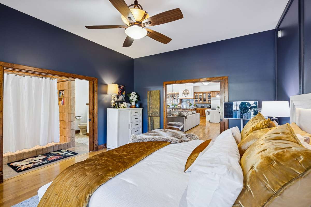 Another view looking toward the bath which has pocket doors dividing the two rooms.