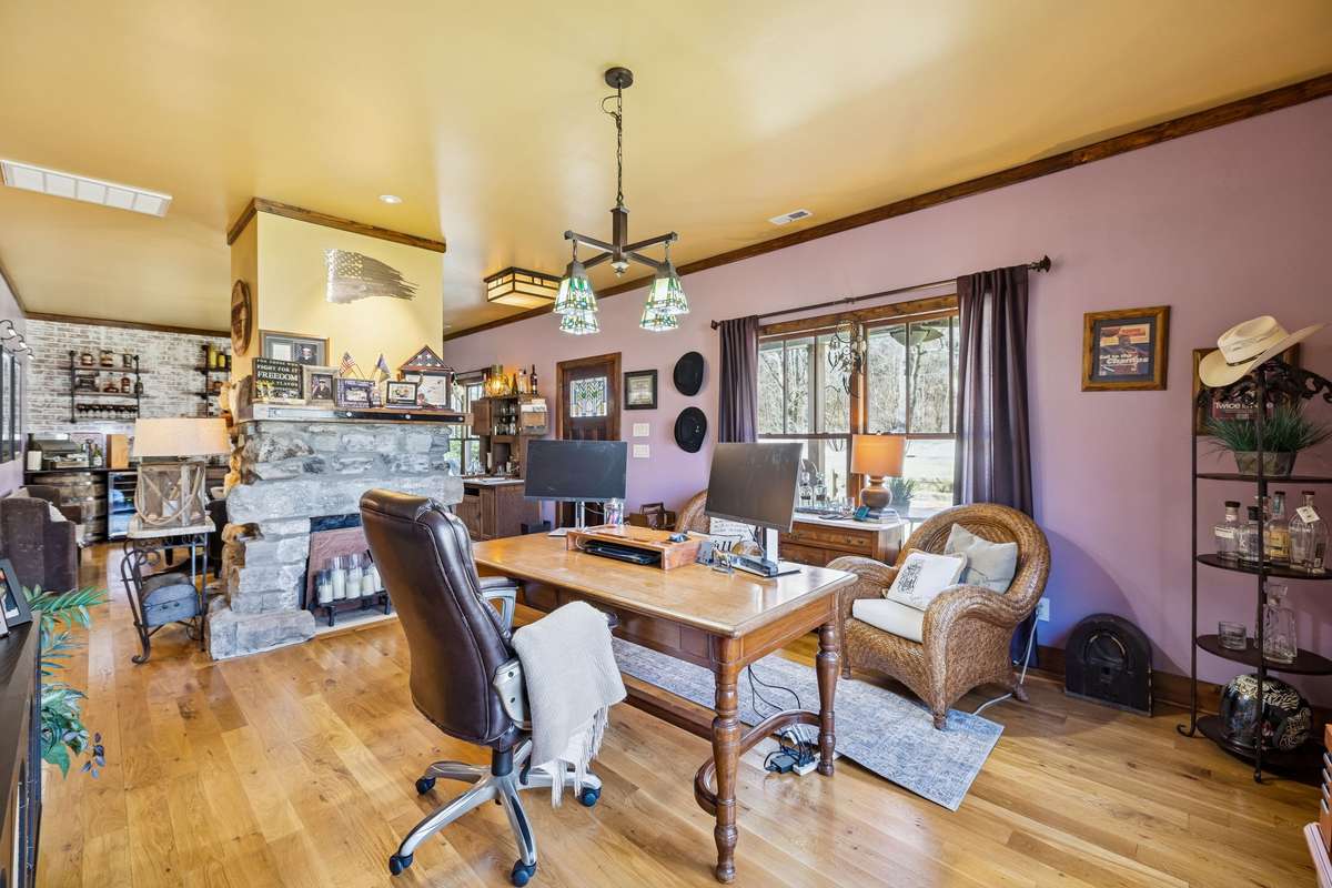 Office with the original fireplace (does not work) but was exposed behind sheetrock! The other side is the "Bourbon Room".