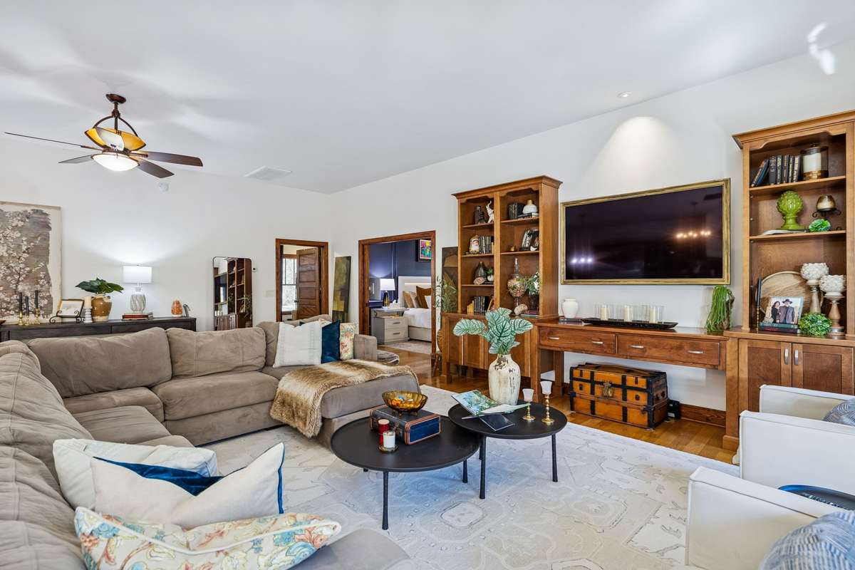 A great view of this expansive Living area and beautiful built-in wall unit!