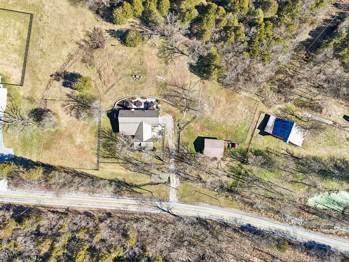 An overhead area view - you can see the line between the horse barn and the neighbor's red barn.