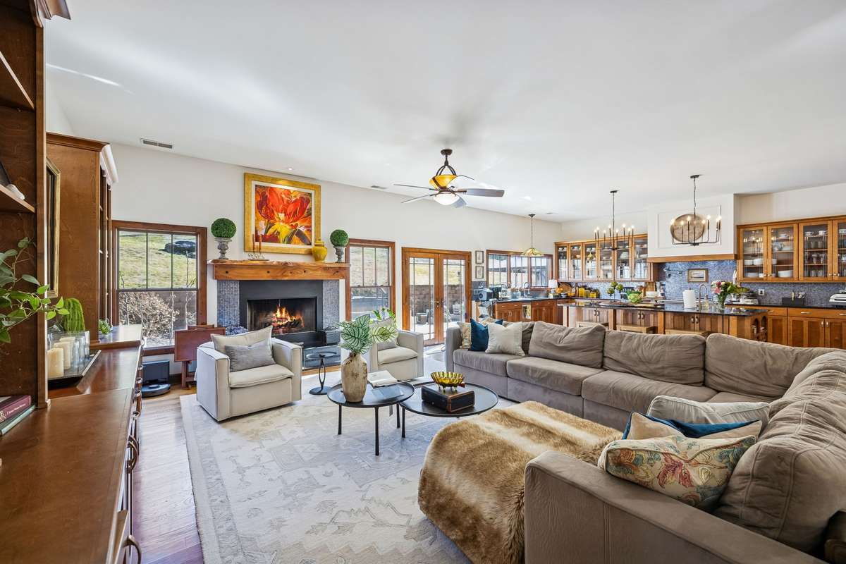 The Living area can accommodate a very large couch!  Notice the wall of windows/doors on the rear of the home!