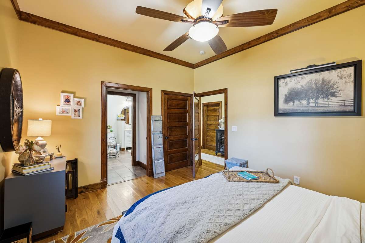 Owner Suite 2 with closet to the rear right area and doorway to the adjoining Bath.