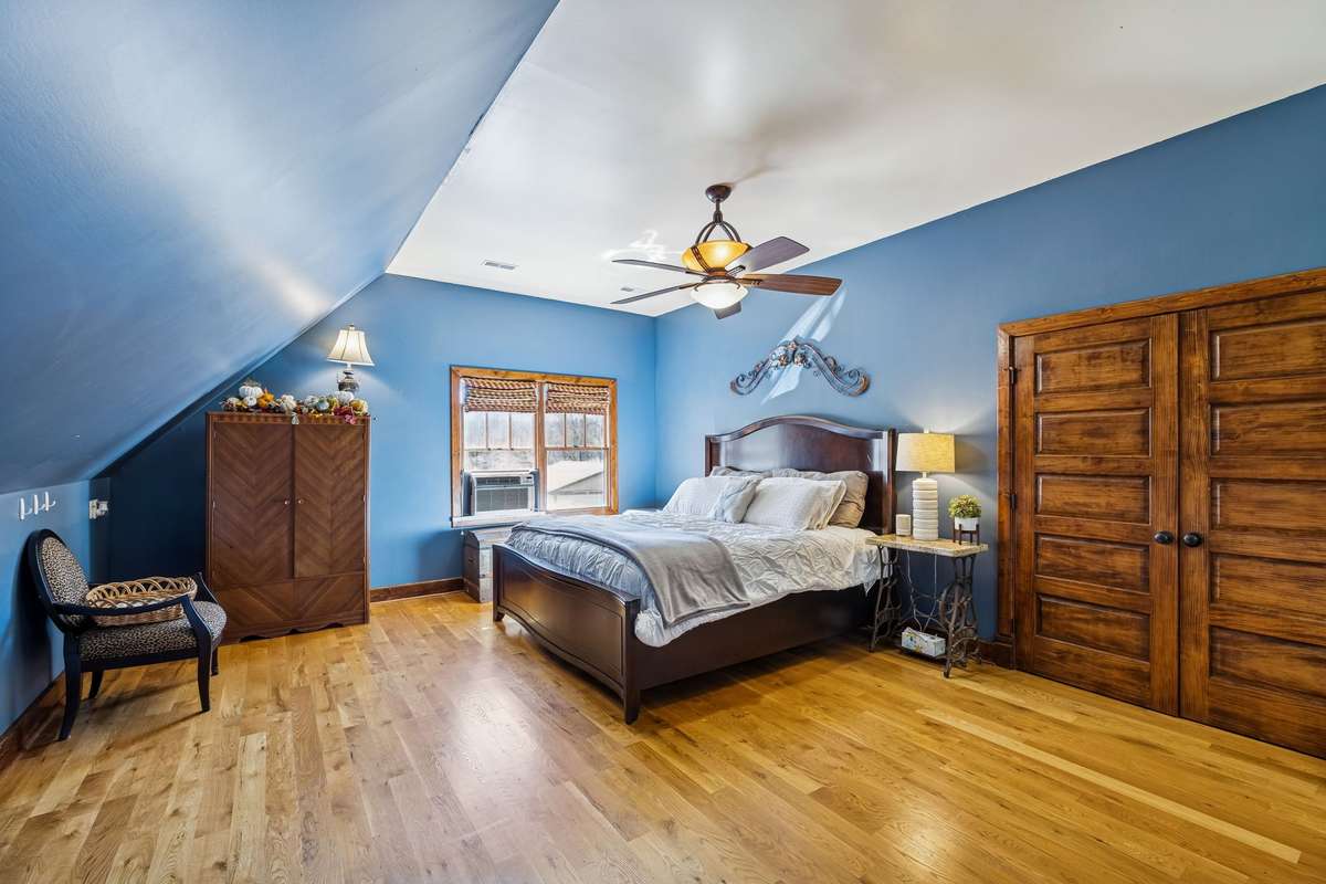 This is the second floor of the home with a "flex" room that can be used as a Bonus Room, family room, play room, media room or a guest bedroom which is the current use for this room.  There is a huge walk-in closet behind the double wooden doors!