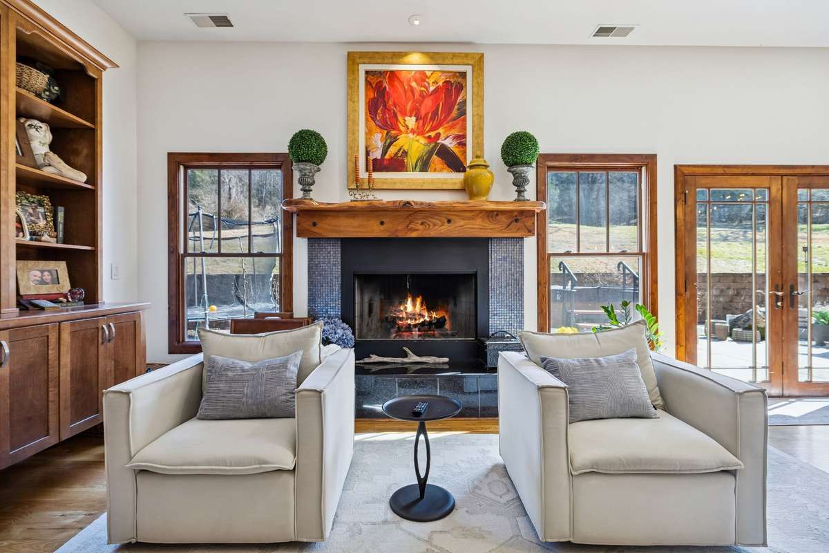 The wood-burning fireplace has a propane gas starter and is a cozy setting for watching movies on cold evenings!