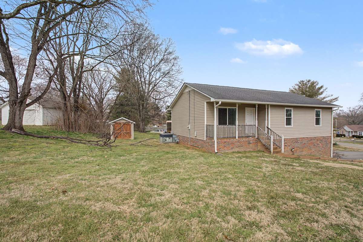 Imagine summer nights from the front porch with crickets chirping and this open southern view in your own corner lot!