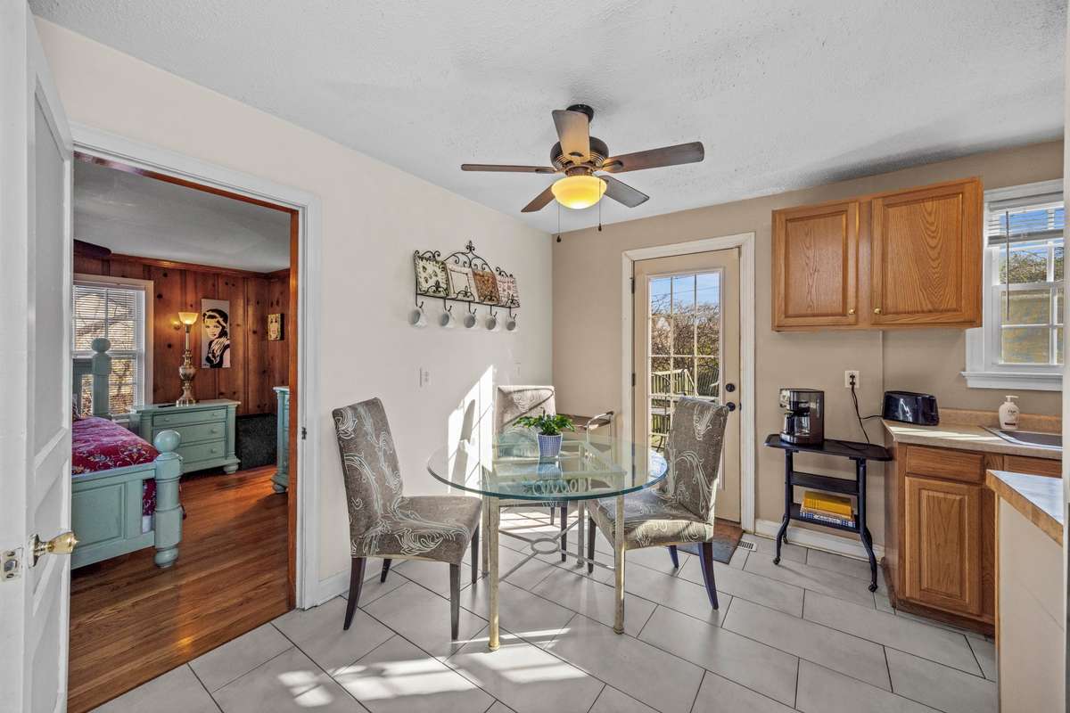 The eat in kitchen takes you to the back deck. And the main bedroom entrance.