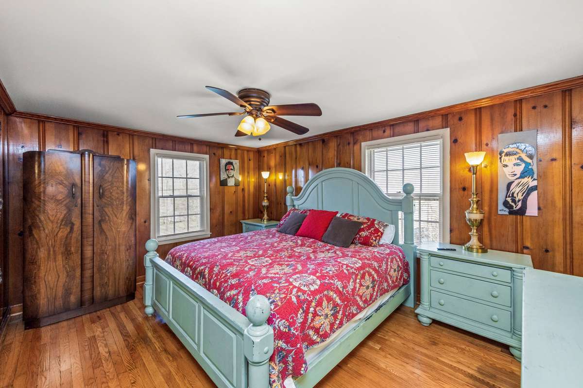 Beautiful original wood paneling and large windows keep the natural light throughout the house.