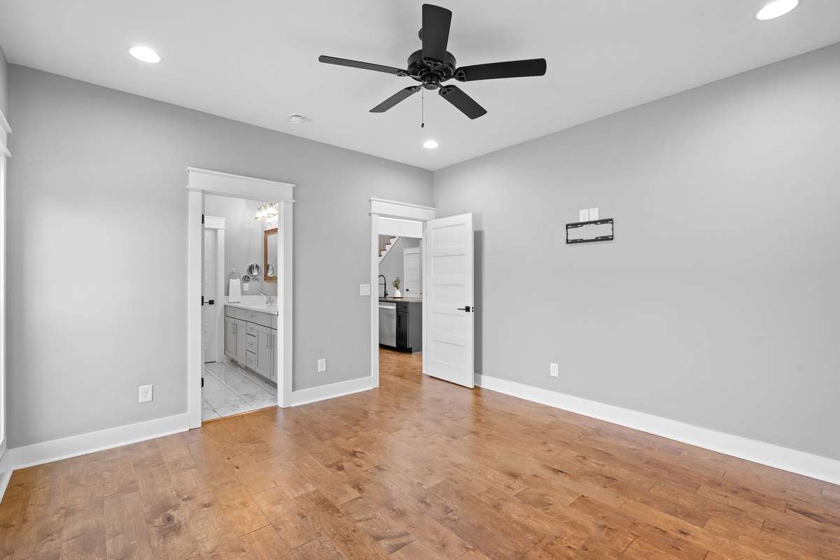 Light-filled primary bedroom with easy flow to the en suite bath and main living areas.