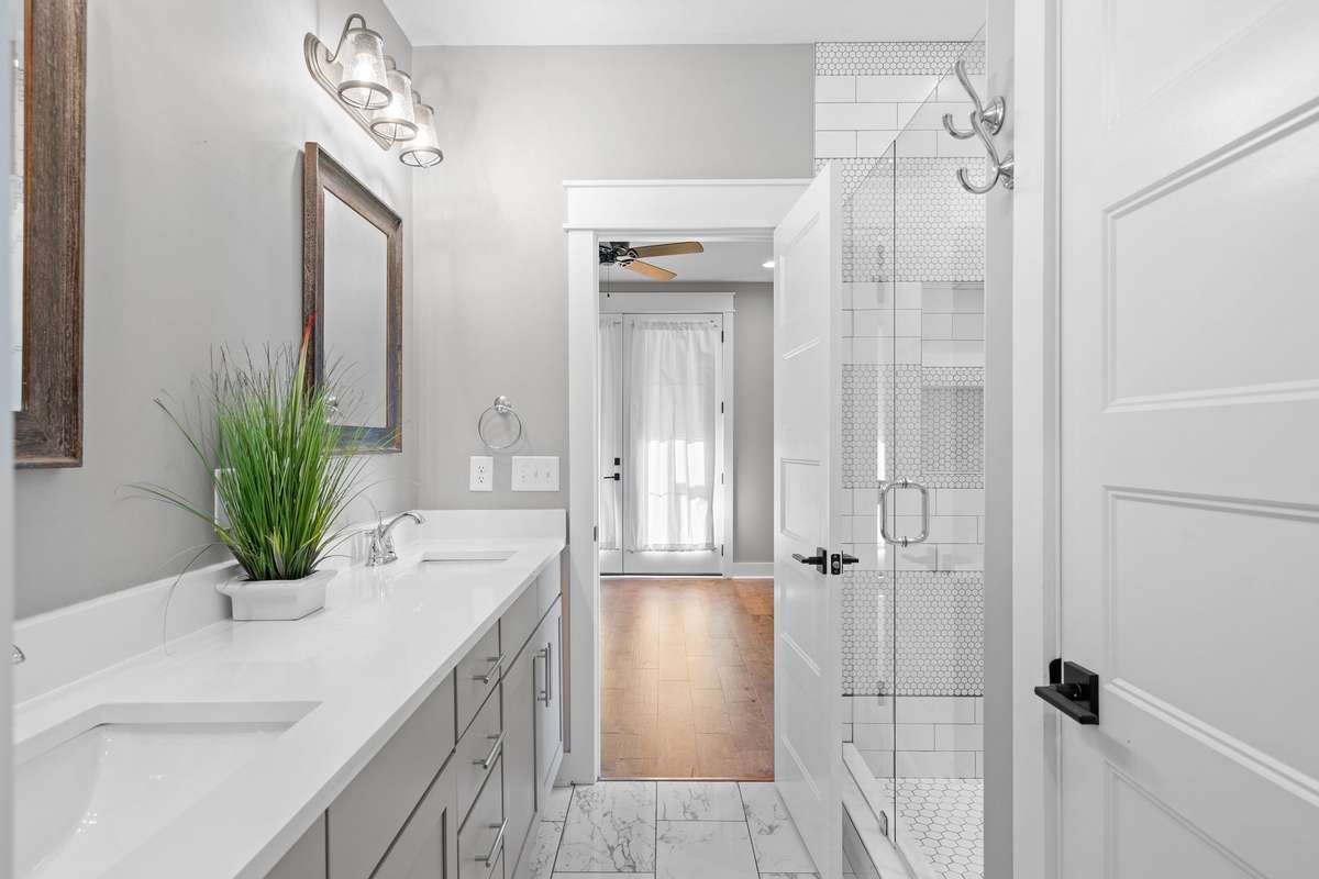 Well-appointed primary bath with spacious layout and direct access to the walk-in closet.