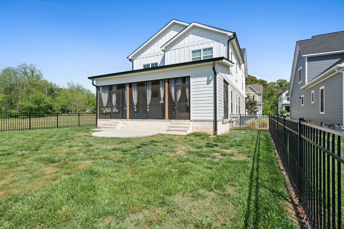 Rear exterior showcasing the home’s charming design and incredible outdoor living space.
