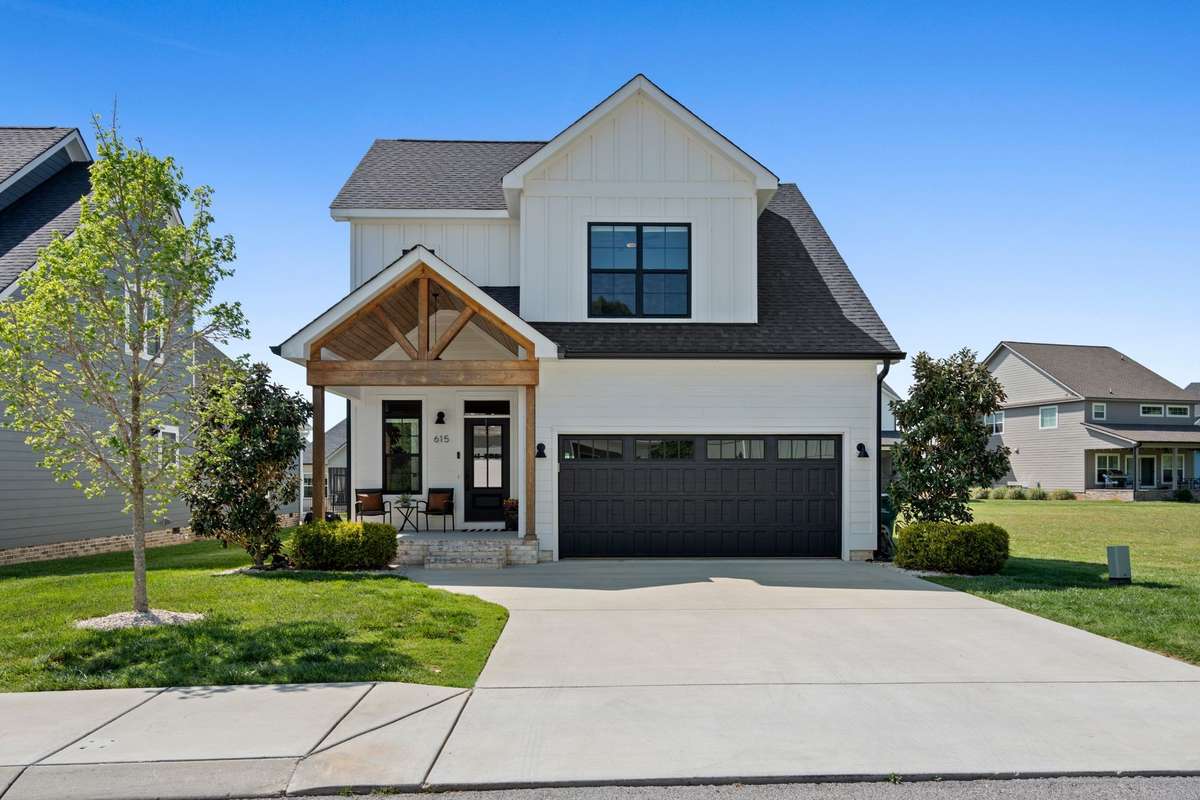 Charming Craftsman-style exterior with welcoming front porch and beautiful curb appeal in Twin Creeks Village.