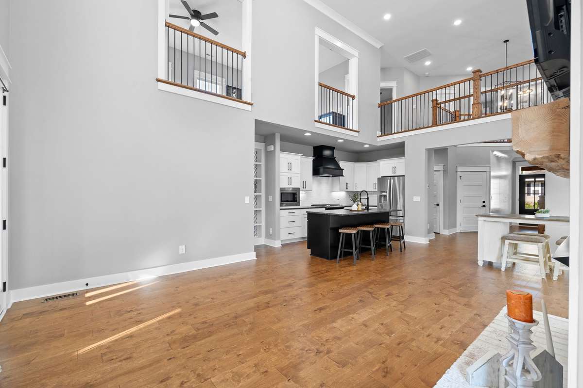 Chef’s kitchen featuring oversized island with seating, perfect for gathering and entertaining.