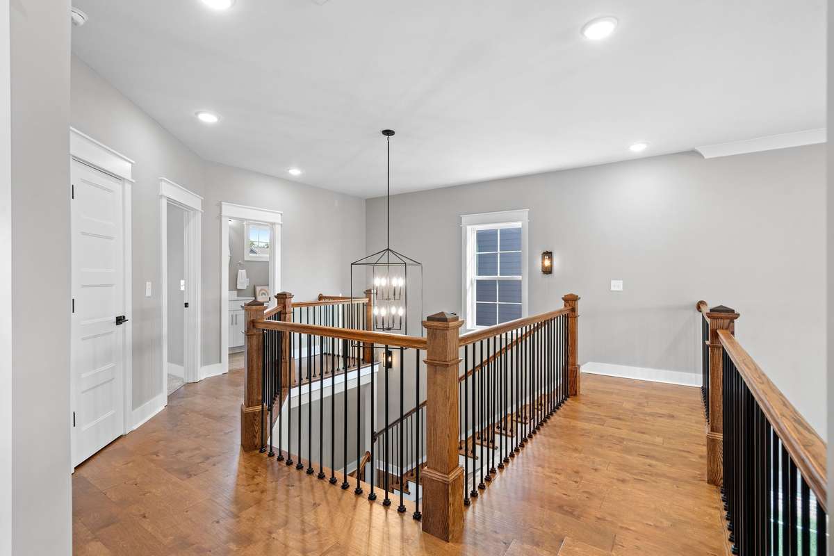 Open second-floor landing overlooking the main living space below.