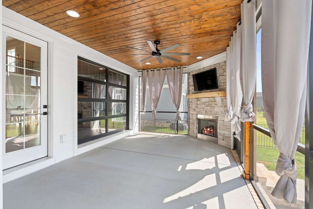 Indoor-outdoor living shines with direct access from the main living area to the screened porch.