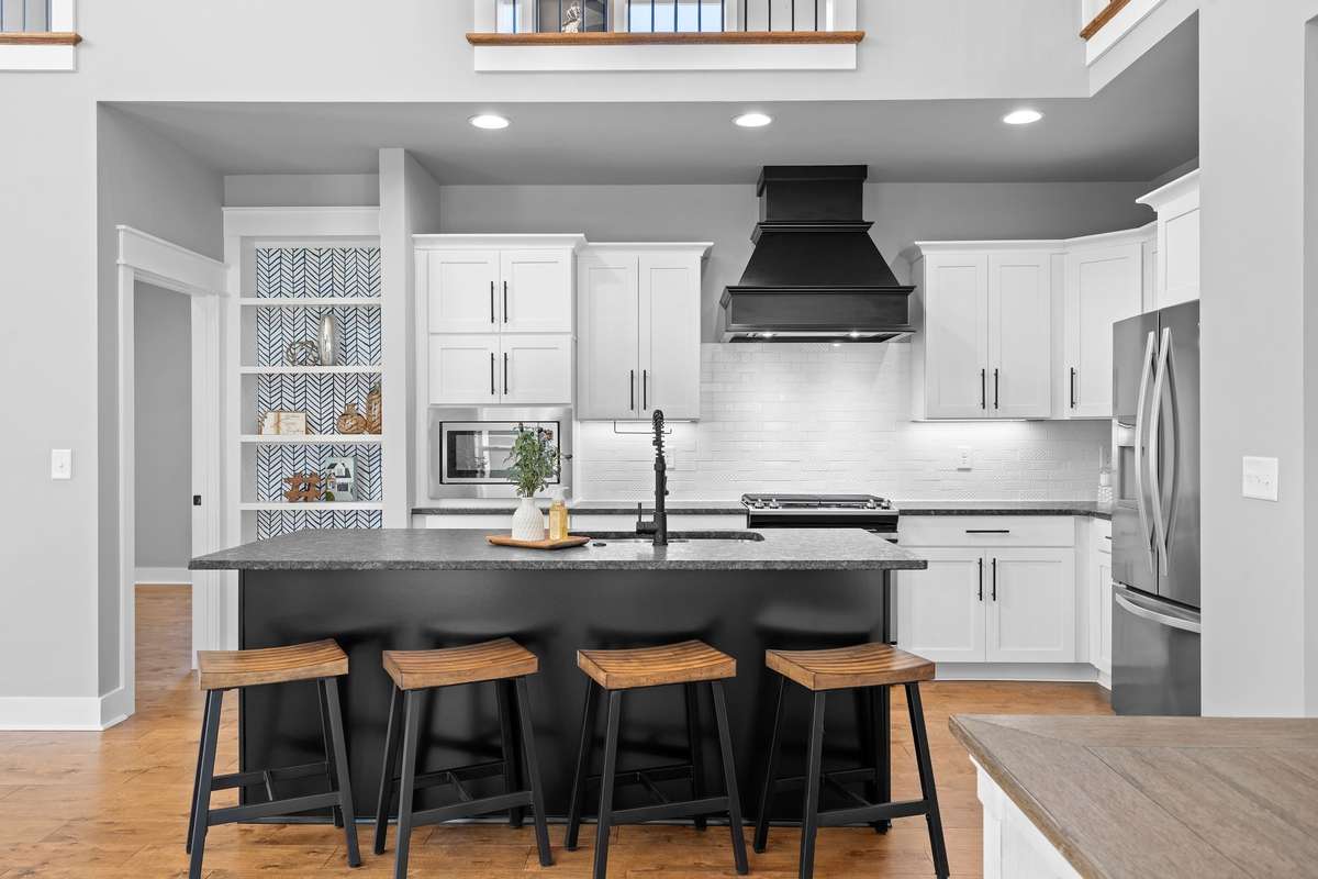 Large center island with ample seating—ideal for casual dining and hosting guests.