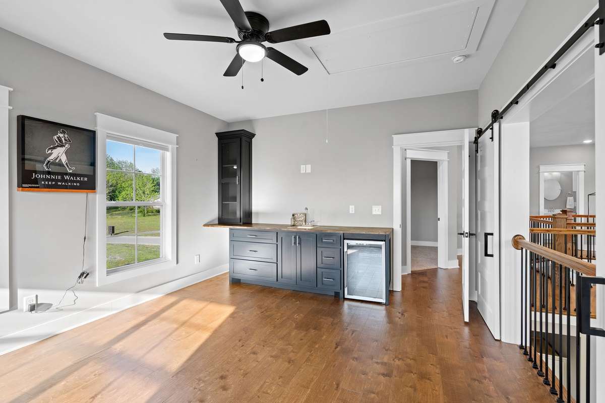 Bonus room featuring wet bar and beverage fridge—perfect for hosting and relaxing.